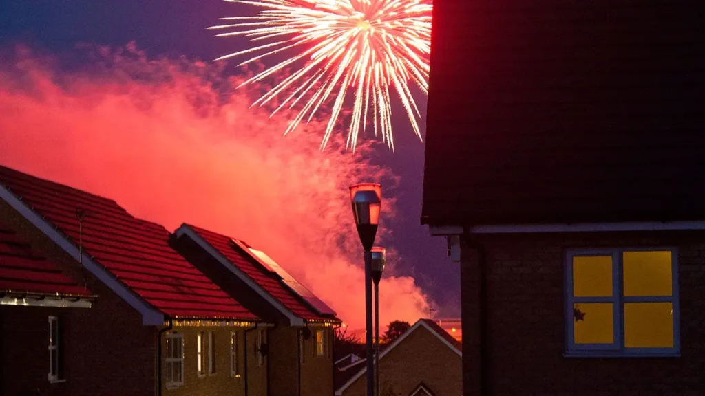 Man in birthday suit uses his hose to protect two homes from a fire caused by fireworks on the Fourth of July