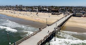 Many people taken into custody after fireworks were thrown into crowds at Newport Beach.