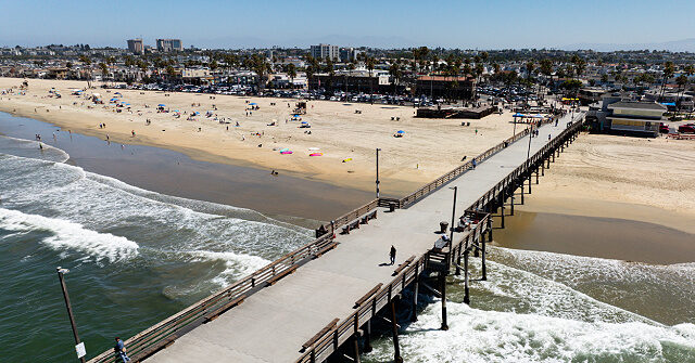 Many people taken into custody after fireworks were thrown into crowds at Newport Beach.