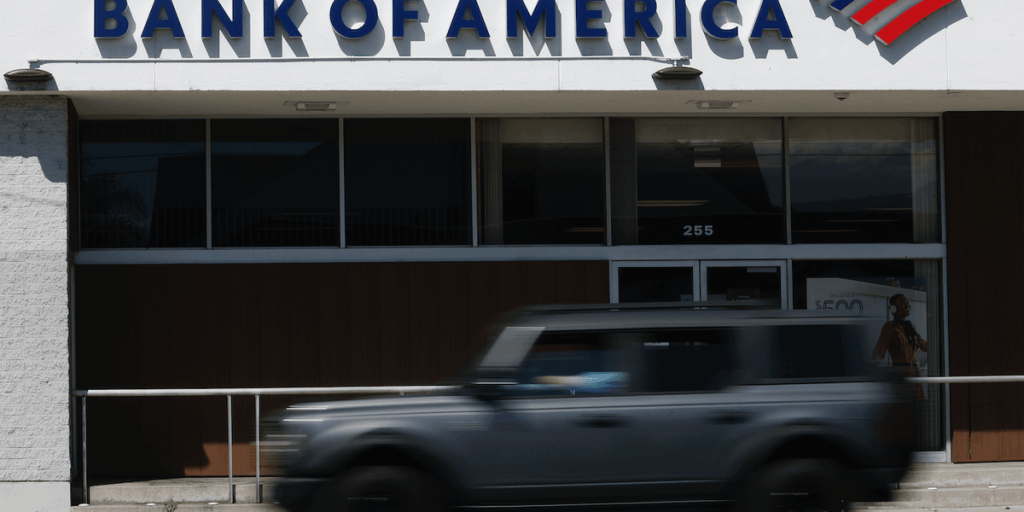 Nine-year-old boy sees armed robbery at bank while trying to open his first checking account; his grandmother describes his reaction as 'surreal'