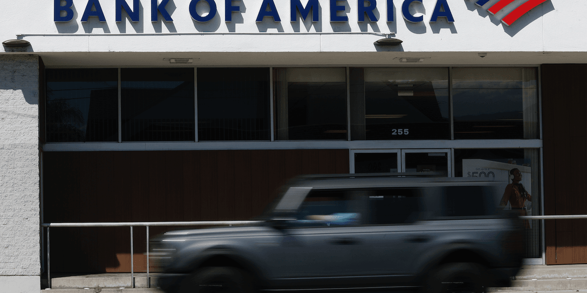 Nine-year-old boy sees armed robbery at bank while trying to open his first checking account; his grandmother describes his reaction as 'surreal'