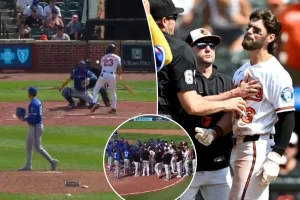 Players rush onto the field in Orioles-Royals game after Blaze Alexander suffers a broken hand