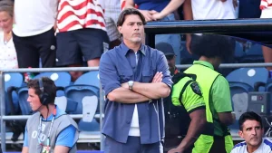 Pochettino reacts by kicking water bottles as the US falls behind Belgium 2-1 at halftime