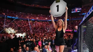 Sophie Cunningham takes off her shoes and enters the Octagon at UFC 329 as an unexpected ring girl