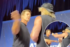Tom Brady smacks 'dork' Logan Paul while Karl-Anthony Towns steps in during chaotic Fanatics Fest event.