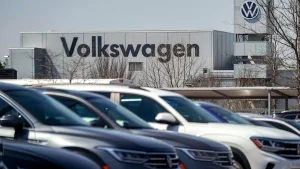Volkswagen's CEO cautions that as many as 100,000 jobs could be eliminated during reorganization.