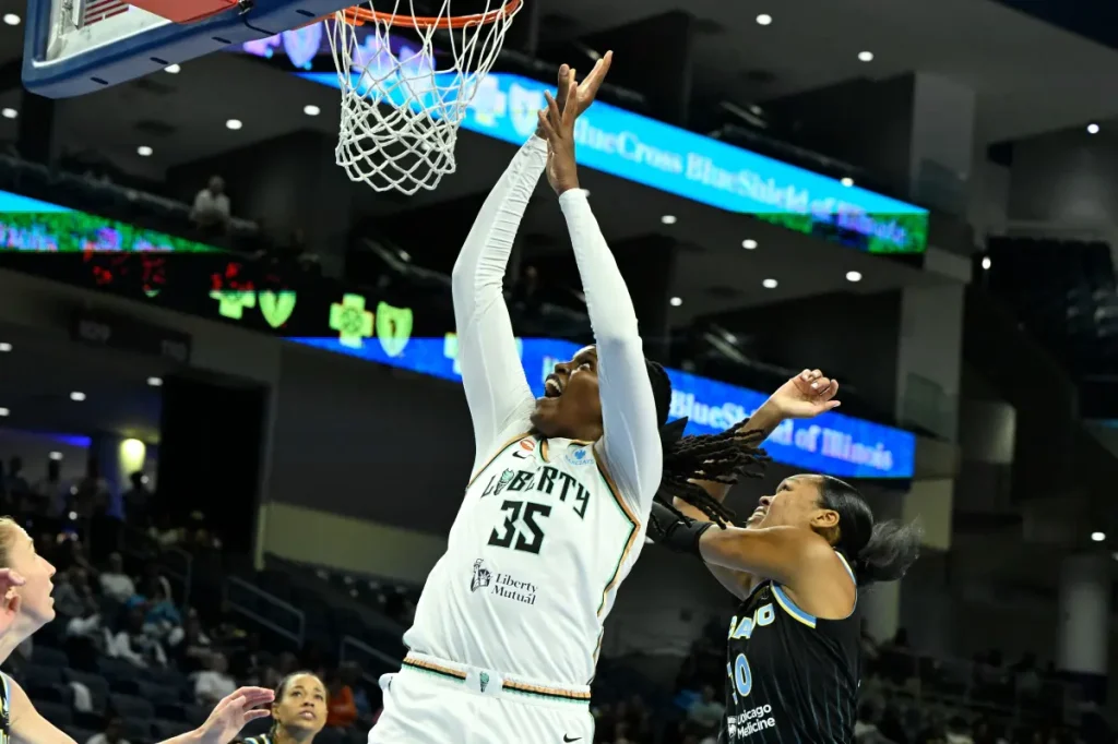 Jonquel Jones leaves the game due to an ankle injury, raising concerns for the Liberty
