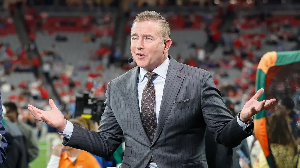 Kirk Herbstreit and his ex-gymnast wife are parents of four boys due to handstands on the bed.