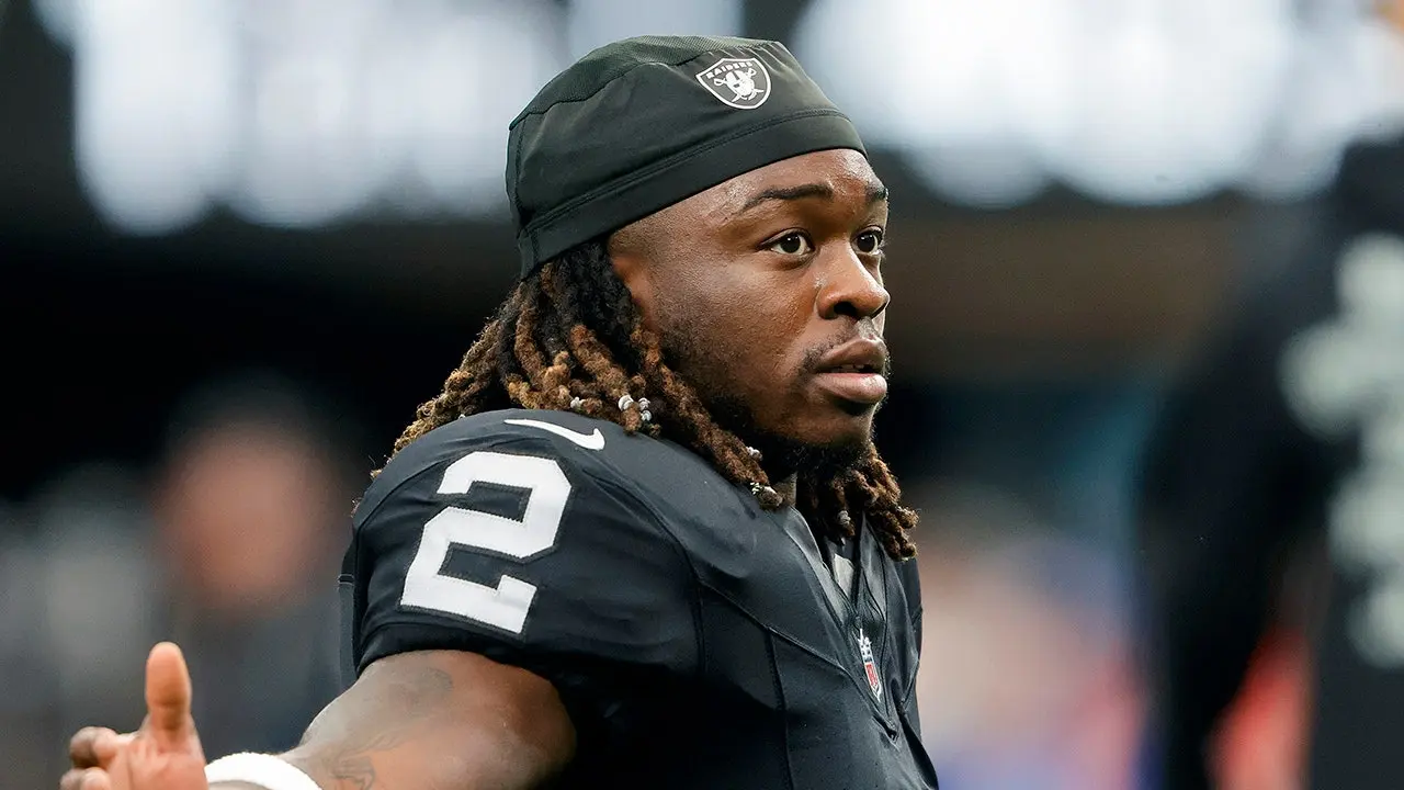 Raiders player Ashton Jeanty appears to have injured his leg during practice at training camp and was assisted off the field.