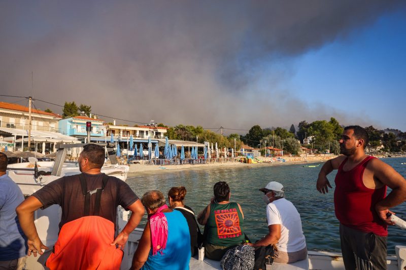 Two wildfires take two lives and lead to mass evacuations on a Greek island while Belgium fights a large fire.