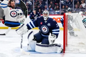 Connor Hellebuyck is suspended by the Jets as the trade situation evolves.