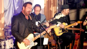 Country singer and ex-college football player Lee Brice criticizes NIL and professional athletes returning to college.