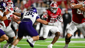 Defending champion Indiana Hoosiers narrowly escape a big challenge from Northwestern in Big Ten opener