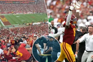 Fans from USC and Oregon clash in the Coliseum stands after a harsh hit on Dante Moore