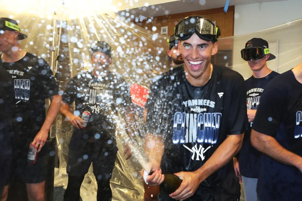 George Lombard Jr. enjoys his first champagne toast after leading the Yankees comeback.
