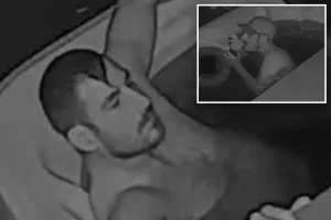 Obsessed individual spotted having an intense interaction with a rubber duck in a stranger's hot tub