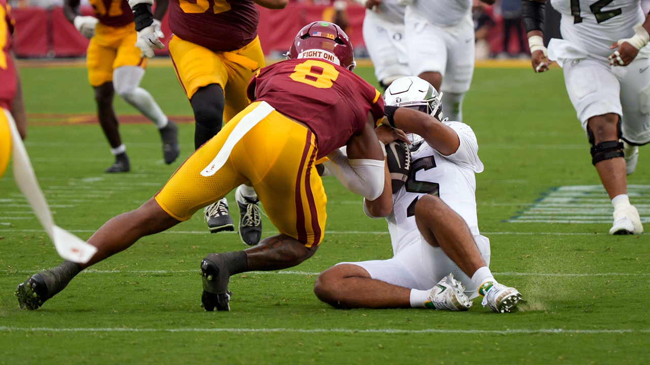 Oregon Ducks quarterback Dante Moore taken off the field after a brutal hit to the head during the game against USC