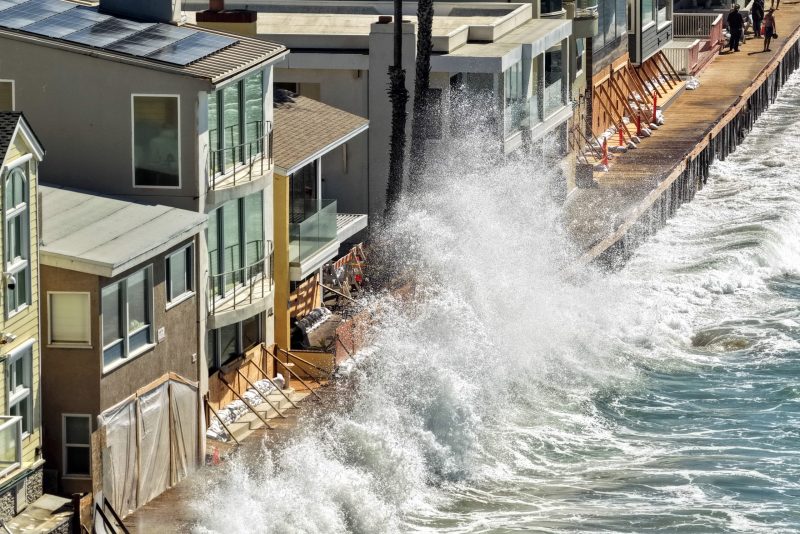 Polo gets downgraded to a tropical storm while moving inland, and Southern California is under coastal flood warnings.