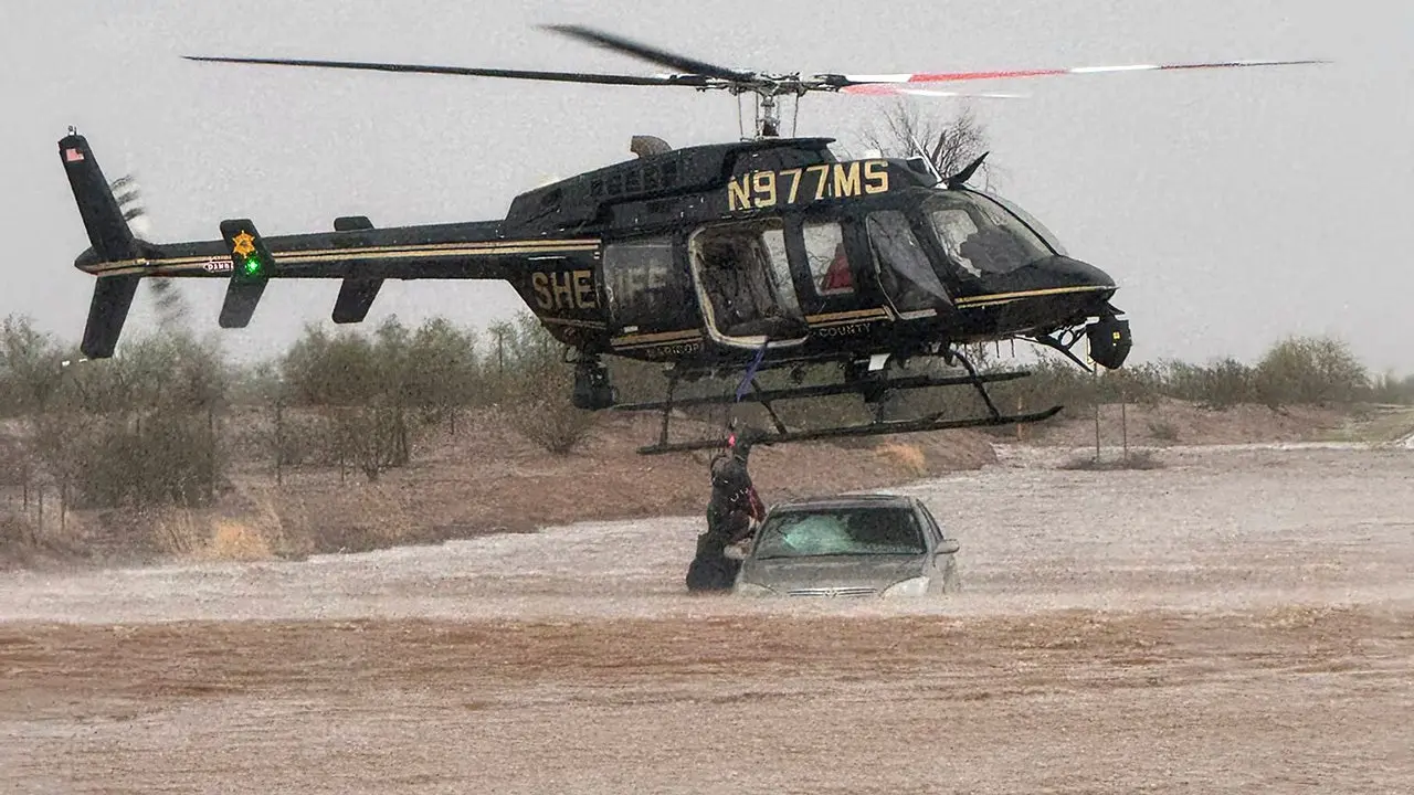 Sheriff's helicopter rescue in Arizona saves two individuals from a flooded vehicle