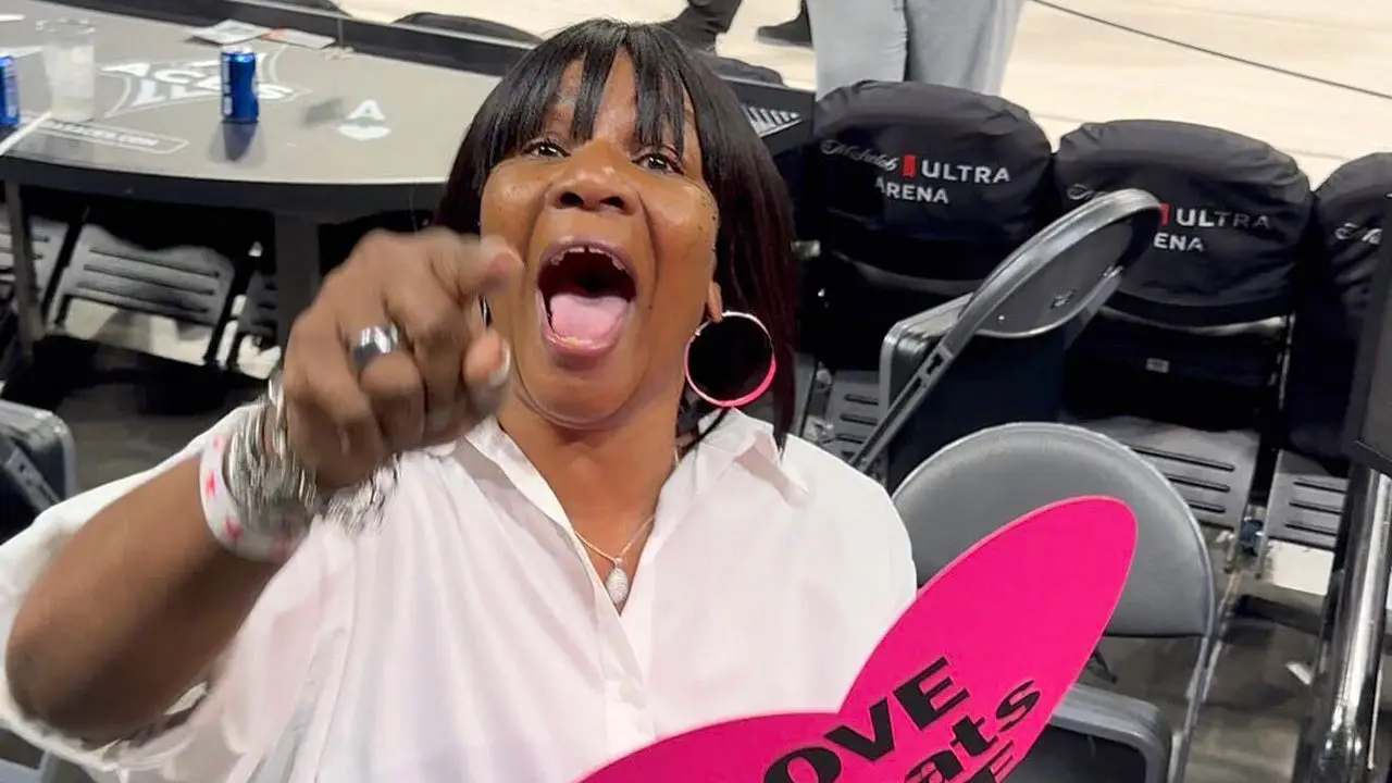 A'ja Wilson's mother reacts strongly when asked to clarify her 'Love Beats Hate' sign after the victory against the Fever in Game 3.