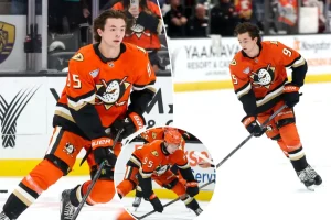 Anaheim Ducks' Roger McQueen celebrates his Disney ties during his first solo lap in the NHL.