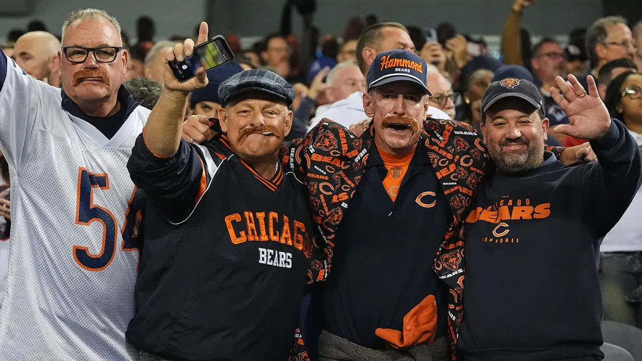 Bears fans sport Mike Ditka's iconic mustache as the franchise legend is remembered during the first home game after his passing