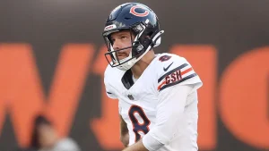 Bears kicker becomes a sensation after attempting to trip a Packers receiver who knocked down a Chicago coach on the sidelines