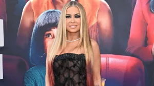 Carmen Electra starts the Halloween season at a gas station, following a police chase and Ball-Sac