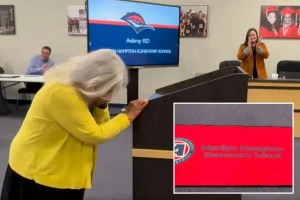 Custodian Marilyn Hampton weeps as a new elementary school is dedicated to her.