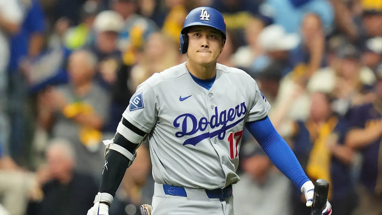Dave Roberts includes Shohei Ohtani in Dodgers' NLCS Game 3 lineup despite his difficulties in the postseason.