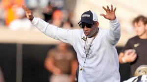 Deion Sanders refers to the reported $50,000 bribe to silence critics as 'a joke' during Colorado's difficulties.