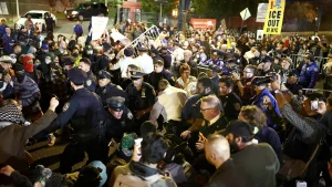 Demonstrators conflict with police following a shooting involving ICE in the Bronx
