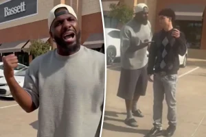 Dez Bryant knocks a phone from a teenager's hand in footage of a parking lot incident.