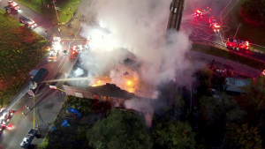 Firefighters in New York City rescue famous church from fire driven by strong winds