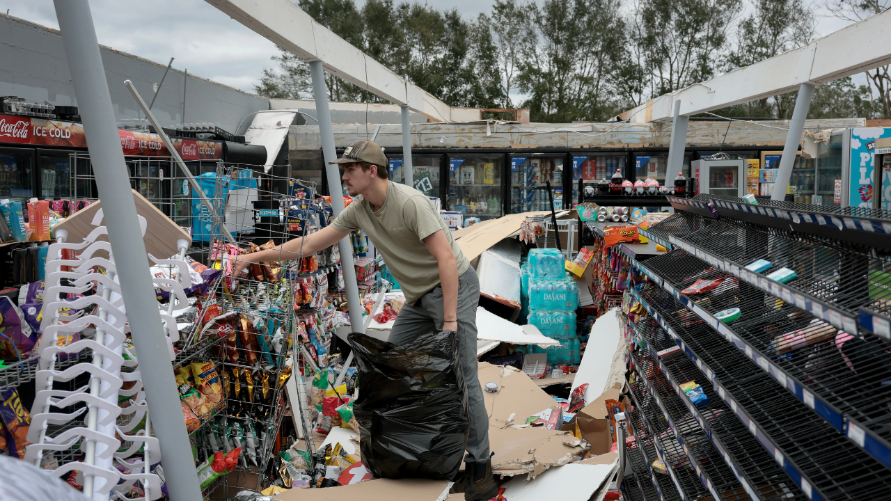 Images of hurricane damage reveal flooding, debris, and cleanup activities.