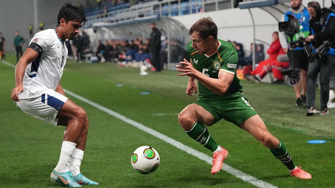 Israeli footballers don armbands to honor victims of the terror attack while their Irish rivals carry out another stunt