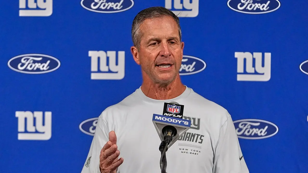 John Harbaugh supports Cam Skattebo and criticizes the NFL for a disputed penalty: 'That's how it should be done'