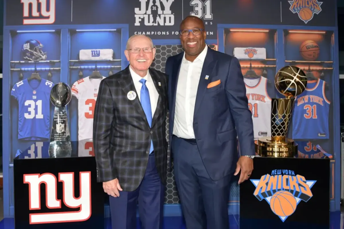 Mike Brown enjoys the opportunity to meet Tom Coughlin at a charity event