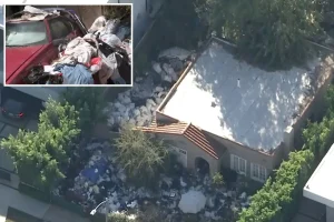 Notorious Fairfax 'trash house' buried in waste for a third time