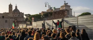 Protesters Holding Palestinian Flags Confront Security Personnel at the Colosseum Gates