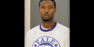 Repeat offender charged with killing an elderly woman, an art gallery owner, during a daytime assault on a Baltimore street.