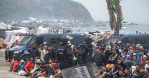 Spanish police start to remove unauthorized migrants from the beach camp in Ceuta.