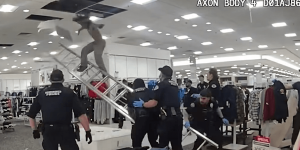 Video: Punk faces consequences after police find him crawling on the roof of a department store