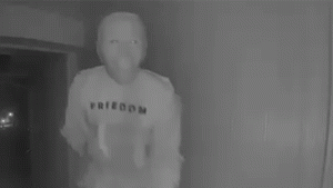 Visitor in a mask performs strange act on doorstep, captured on video