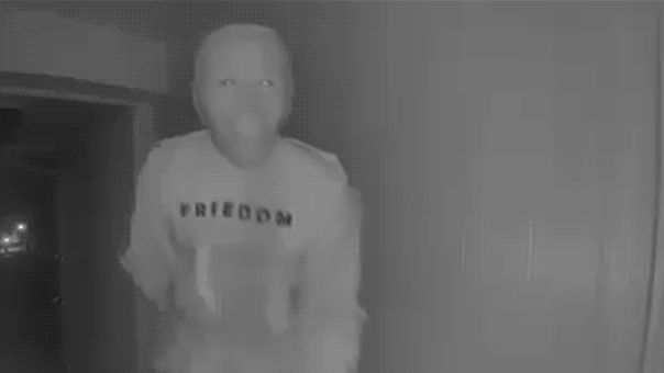 Visitor in a mask performs strange act on doorstep, captured on video