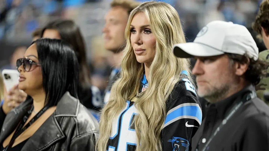 WWE star Charlotte Flair walks into the Panthers' stadium and drums up excitement before the game against the Lions.