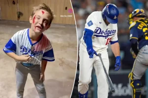 Young Brewers supporter playfully mocks Dodgers with funny Halloween outfit after NLCS victory.
